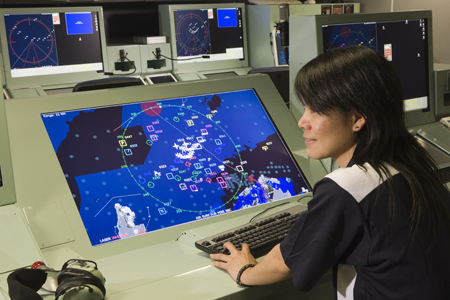 A photo of a DSTG researcher in the ANZAC Combat System Integration Laboratory.