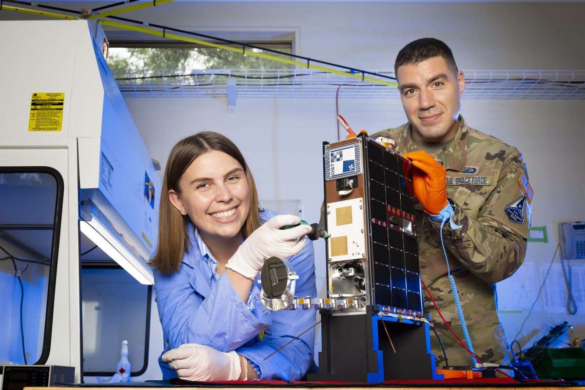 Scientists Franke Agenbag and US Major Chris Rocker with the Buccaneer CubeSat.