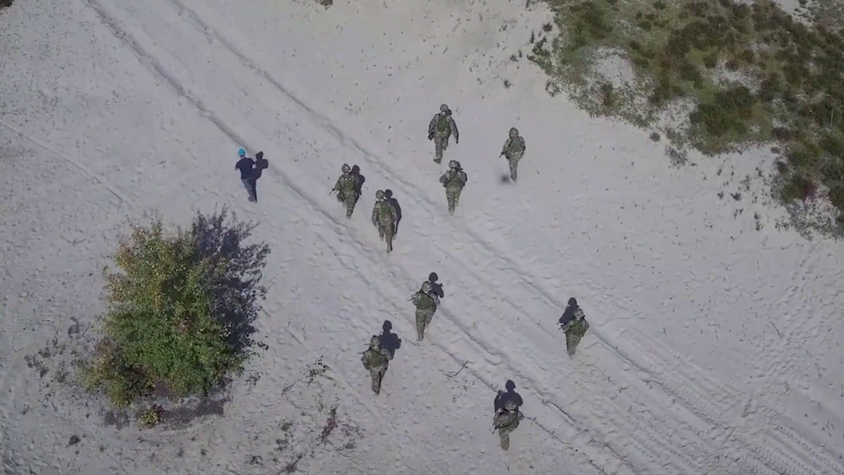 Bin Lee and the DRDC team gathering imagery for camouflage assessment in a desert environment from a drone's viewpoint.